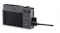 Rear angled view of a Panasonic Lumix camera with the LCD screen and a cable plugged into the side port for charging or data transfer Rear angled view of a Panasonic Lumix camera with the LCD screen and a cable plugged into the side port for charging or data transfer