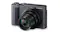 Angled view of a Lumix camera with the extended Leica zoom lens, highlighting lens details and the front grip Angled view of a Lumix camera with the extended Leica zoom lens, highlighting lens details and the front grip