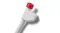A close-up angle of a dishwasher drain hose connector with a ribbed flexible hose and a red locking cap A close-up angle of a dishwasher drain hose connector with a ribbed flexible hose and a red locking cap