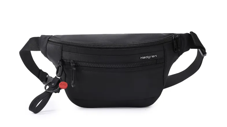 Front view of the Hedgren Ziva crossbody waistbag in black, featuring dual zip compartments, smooth fabric, and an adjustable strap Front view of the Hedgren Ziva crossbody waistbag in black, featuring dual zip compartments, smooth fabric, and an adjustable strap