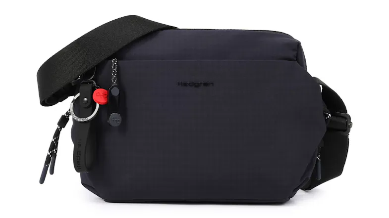 Hedgren Kosho crossbody bag in blue with adjustable strap and front zip pocket Hedgren Kosho crossbody bag in blue with adjustable strap and front zip pocket