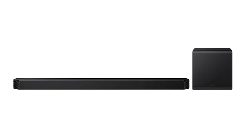 Long black soundbar positioned beside wireless subwoofer, highlighting minimalist theatre designs Long black soundbar positioned beside wireless subwoofer, highlighting minimalist theatre designs