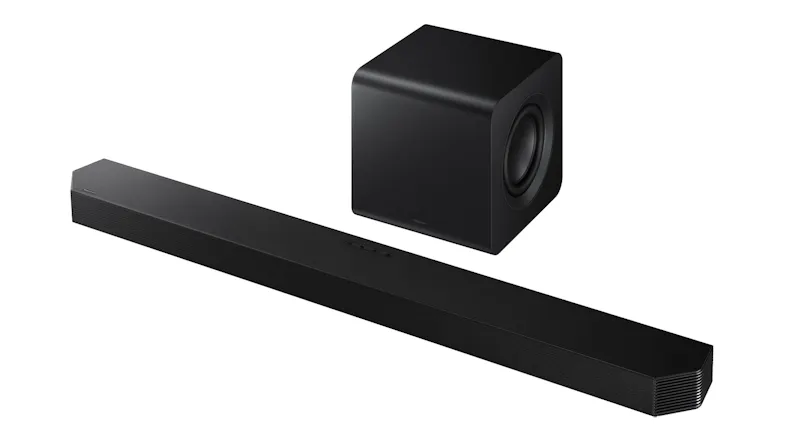 A left-angled view of a sleek black soundbar paired with a cube subwoofer A left-angled view of a sleek black soundbar paired with a cube subwoofer