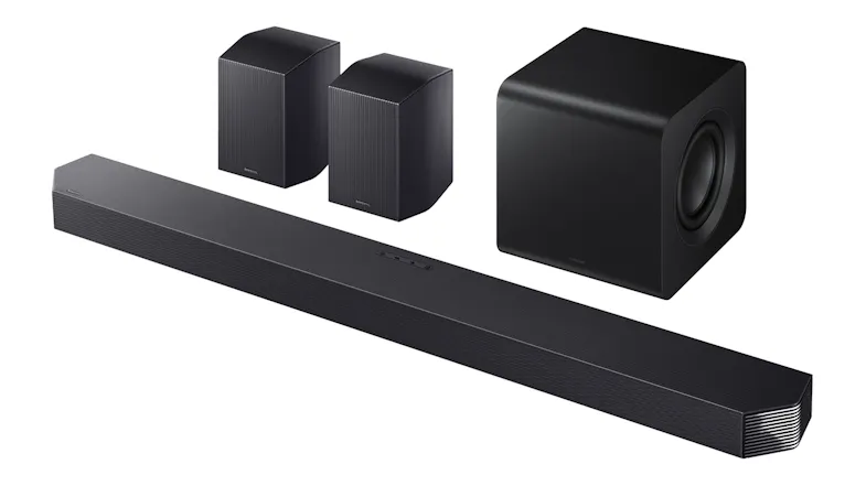 An angled view of a soundbar with two rear speakers and a wireless subwoofer An angled view of a soundbar with two rear speakers and a wireless subwoofer