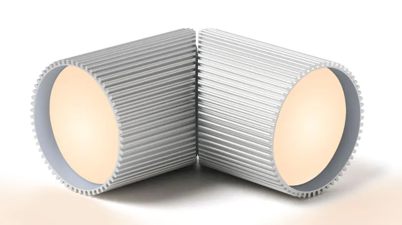 Rear angle view of Lexon Ray small aluminium LED lights placed back‑to‑back, highlighting textured cylindrical housing Rear angle view of Lexon Ray small aluminium LED lights placed back‑to‑back, highlighting textured cylindrical housing