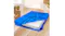 BlueDreamz PE mattress storage bag unzipped on a wooden floor, showing the mattress in a bright room with packed boxes nearby BlueDreamz PE mattress storage bag unzipped on a wooden floor, showing the mattress in a bright room with packed boxes nearby
