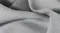 A close-up view of a graphene-infused modal fabric showing fine weave texture and natural drape, with premium bedding material detail A close-up view of a graphene-infused modal fabric showing fine weave texture and natural drape, with premium bedding material detail