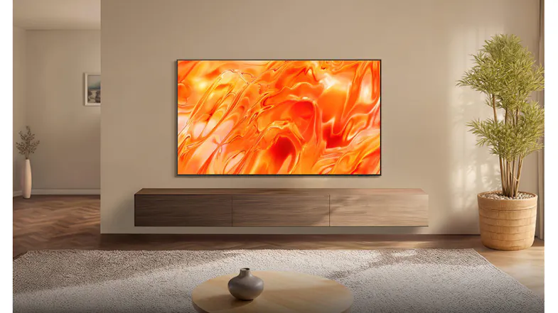 Modern living room with a wall-mounted TV displaying bright abstract art above a wooden console and a plant Modern living room with a wall-mounted TV displaying bright abstract art above a wooden console and a plant