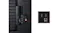 Rear view of a TV showing HDMI, USB, and LAN ports, with a zoomed-in inset highlighting the connections Rear view of a TV showing HDMI, USB, and LAN ports, with a zoomed-in inset highlighting the connections