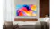 Samsung TV wall-mounted in a modern living room with a sofa, chair, and wooden panel backdrop Samsung TV wall-mounted in a modern living room with a sofa, chair, and wooden panel backdrop