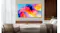 Samsung TV wall-mounted in a modern living room with a sofa, chair, and wooden panel backdrop Samsung TV wall-mounted in a modern living room with a sofa, chair, and wooden panel backdrop