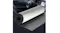 Silver car insulation mat partially unrolled, showing black textured backing for acoustic and heat barrier use Silver car insulation mat partially unrolled, showing black textured backing for acoustic and heat barrier use