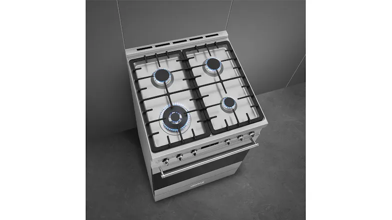 A top view of a classic 60cm gas cooktop with 4 burners, cast iron grates and visible blue flames on a stainless steel hob A top view of a classic 60cm gas cooktop with 4 burners, cast iron grates and visible blue flames on a stainless steel hob