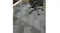 Black office chair on a clear anti-slip floor mat under the desk, protecting the carpet with a textured grip surface Black office chair on a clear anti-slip floor mat under the desk, protecting the carpet with a textured grip surface