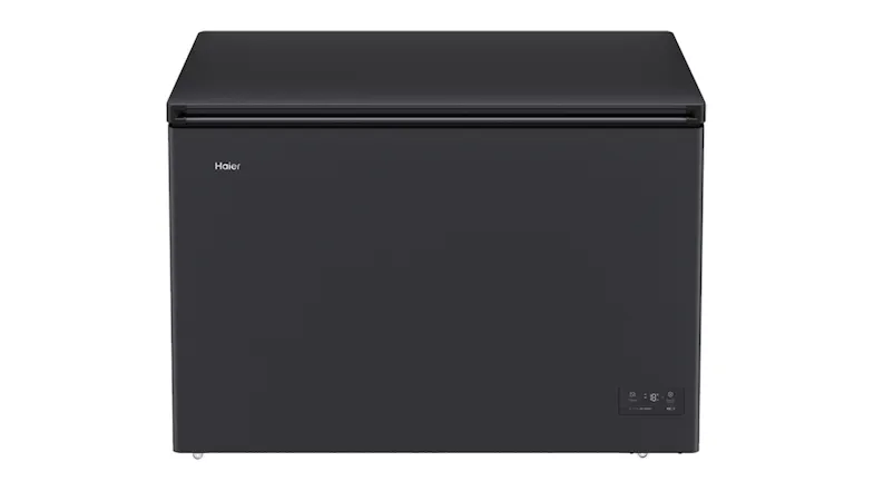 Black Haier 500 Series 294L Hybrid chest freezer, front view with top lid closed and a small digital control panel on the lower right Black Haier 500 Series 294L Hybrid chest freezer, front view with top lid closed and a small digital control panel on the lower right