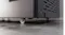 Close-up of the Haier 500 freezer base with a caster wheel and rear vent panel on a textured metal surface Close-up of the Haier 500 freezer base with a caster wheel and rear vent panel on a textured metal surface