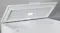 Close-up of the Haier white chest freezer with open lid Close-up of the Haier white chest freezer with open lid