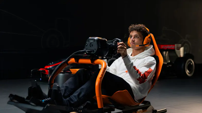 Low-angle front view of a person showcasing a racing wheel Low-angle front view of a person showcasing a racing wheel