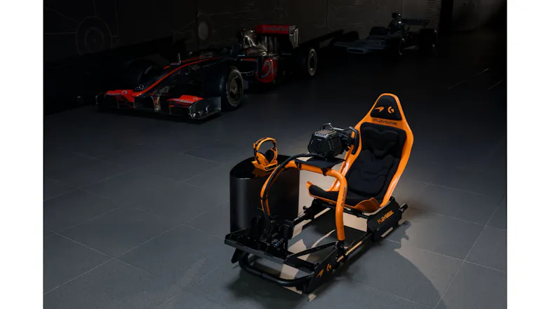 Profile view of a Playseat Formula Instinct racing rig with branding Profile view of a Playseat Formula Instinct racing rig with branding
