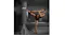 A person delivering a high kick to a black “CENTRA” freestanding punching bag in a dimly lit gym setting A person delivering a high kick to a black “CENTRA” freestanding punching bag in a dimly lit gym setting