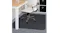 An office chair positioned on a clear Marlow square chair mat with pins, protecting the carpet flooring An office chair positioned on a clear Marlow square chair mat with pins, protecting the carpet flooring