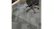 An office chair positioned on a clear Marlow square chair mat with pins, protecting the carpet flooring An office chair positioned on a clear Marlow square chair mat with pins, protecting the carpet flooring