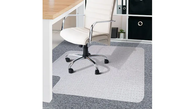 Office chair on a clear floor protection mat under the desk, textured surface shield for carpet against scratches and wea Office chair on a clear floor protection mat under the desk, textured surface shield for carpet against scratches and wea