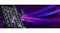 Close-up view of the RGB-lit gaming keypad with several keys floating above switches against a purple motion background Close-up view of the RGB-lit gaming keypad with several keys floating above switches against a purple motion background