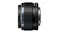 Side view of a compact black Olympus 25mm camera lens with textured focus ring Side view of a compact black Olympus 25mm camera lens with textured focus ring