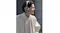 Side view of a person using the Sony adaptive noise-cancelling headphones Side view of a person using the Sony adaptive noise-cancelling headphones
