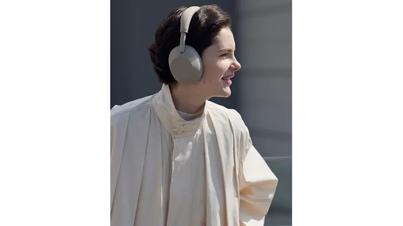 Side view of a person using the Sony adaptive noise-cancelling headphones Side view of a person using the Sony adaptive noise-cancelling headphones