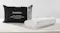 SleepMaker gel-infused cool touch contour pillow in white textured fabric next to its black zippered carrying bag SleepMaker gel-infused cool touch contour pillow in white textured fabric next to its black zippered carrying bag