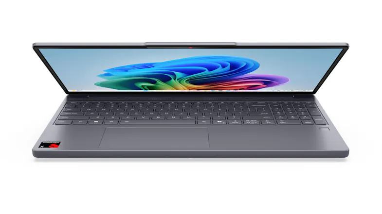 An open Lenovo laptop showing a full keyboard, a large touchpad, and a bright Windows display An open Lenovo laptop showing a full keyboard, a large touchpad, and a bright Windows display