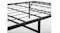 Close-up of a black folding metal bed frame grid and corner joints with screws and support bars Close-up of a black folding metal bed frame grid and corner joints with screws and support bars