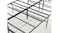 Top view of a folding metal bed frame showing grid surface, centre bar, and support structure Top view of a folding metal bed frame showing grid surface, centre bar, and support structure