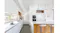 Minimalist kitchen with white cabinets, wood details, an island bench, and pendant lighting Minimalist kitchen with white cabinets, wood details, an island bench, and pendant lighting
