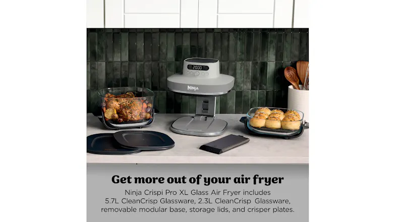 inja Crispi Pro air fryer displayed on a kitchen countertop with accessories and glass bowls inja Crispi Pro air fryer displayed on a kitchen countertop with accessories and glass bowls