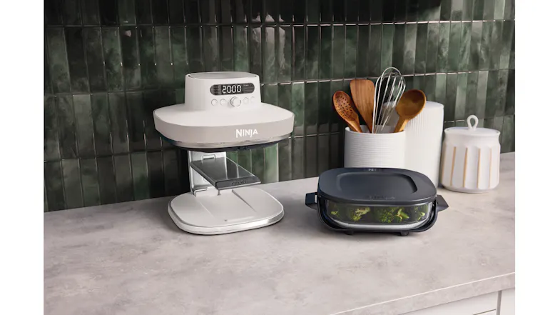 Ninja Crispi Pro air fryer on a kitchen countertop with the heating unit raised, and a metal tray extended Ninja Crispi Pro air fryer on a kitchen countertop with the heating unit raised, and a metal tray extended