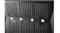 Close-up of a black range hood underside with slotted metal filters and four bright LED lights in a row Close-up of a black range hood underside with slotted metal filters and four bright LED lights in a row