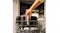 Person placing the Braun MultiFry 5 air fryer basket into a dishwasher rack, holding the silver handle Person placing the Braun MultiFry 5 air fryer basket into a dishwasher rack, holding the silver handle