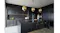 Luxury kitchen design with black finishes, a spacious island, and modern pendant light fixtures Luxury kitchen design with black finishes, a spacious island, and modern pendant light fixtures