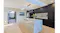 Modern kitchen with a marble island, pendant lighting, dark cabinets, and built-in appliances Modern kitchen with a marble island, pendant lighting, dark cabinets, and built-in appliances