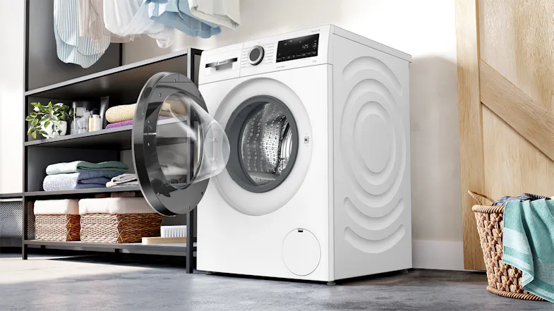 Series 6 10kg Washer with open door in a bright, modern laundry room setting Series 6 10kg Washer with open door in a bright, modern laundry room setting