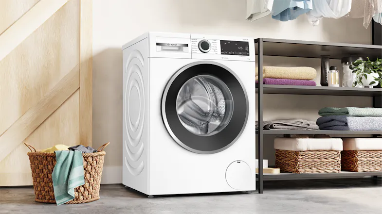White Bosch 10kg front loader washer integrated into a clean, modern laundry room setup White Bosch 10kg front loader washer integrated into a clean, modern laundry room setup