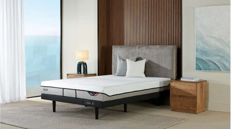 Pro Air Firm Queen Mattress on a modern bedframe with a grey fabric headboard and wooden nightstands Pro Air Firm Queen Mattress on a modern bedframe with a grey fabric headboard and wooden nightstands