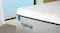 A close up of a corner of the mattress with its two zippers on the side A close up of a corner of the mattress with its two zippers on the side