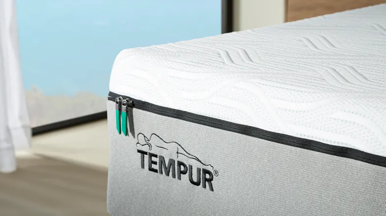 A close up of a corner of the mattress with its two zippers on the side A close up of a corner of the mattress with its two zippers on the side