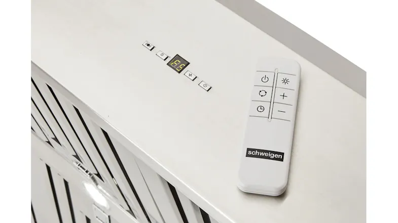 A close-up angled view of the Schweigen rangehood control panel with remote showing its digital disy and lights A close-up angled view of the Schweigen rangehood control panel with remote showing its digital disy and lights