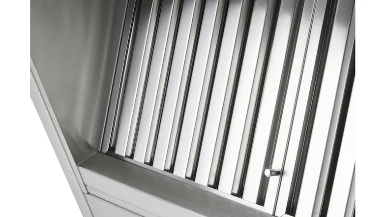 Detailed view of the stainless steel rangehood filters with vertical baffles and a metal surface Detailed view of the stainless steel rangehood filters with vertical baffles and a metal surface