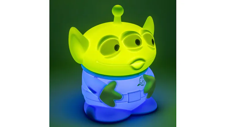 Alien SquishyGlo light glowing on a dark green gradient background Alien SquishyGlo light glowing on a dark green gradient background